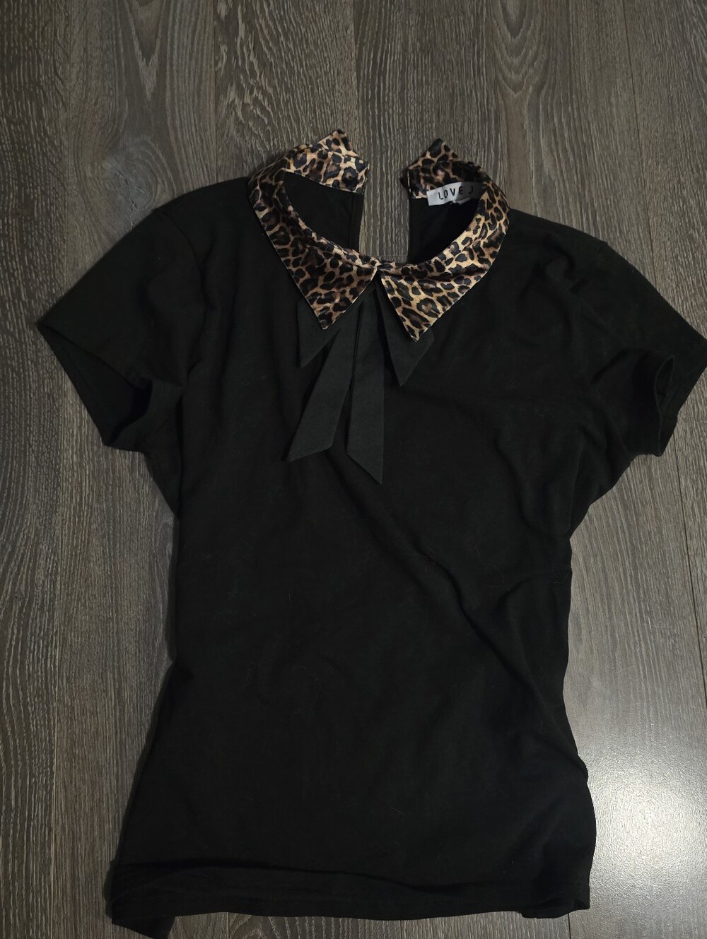 Black Short-Sleeve Top with Cheetah Print Collar and Bow